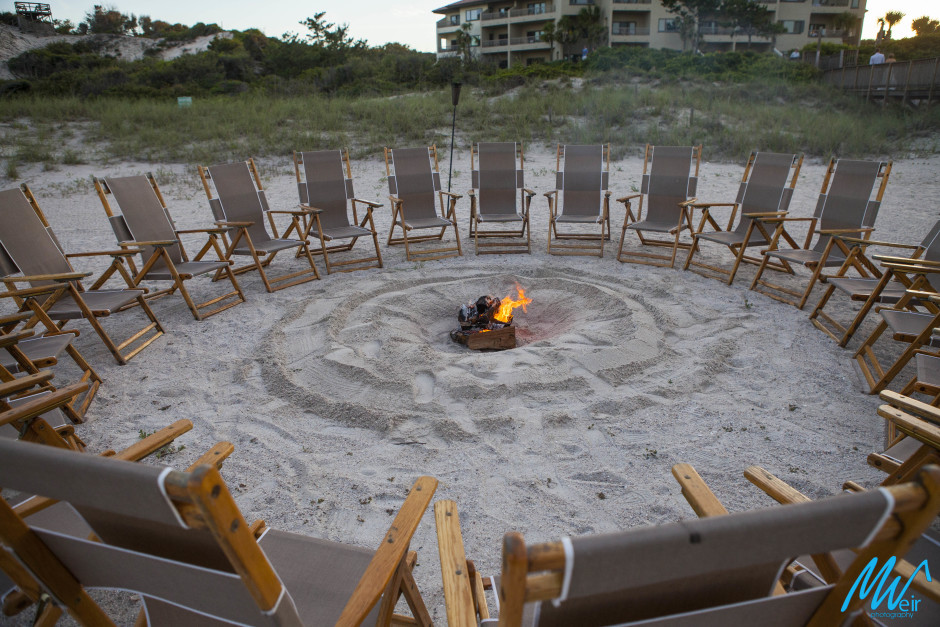 bonfire on the beach during a wedding reception