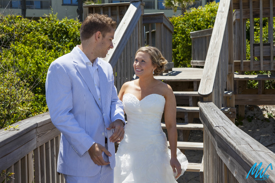 groom seeing his bride for the first time on their wedding day on the boardwalk