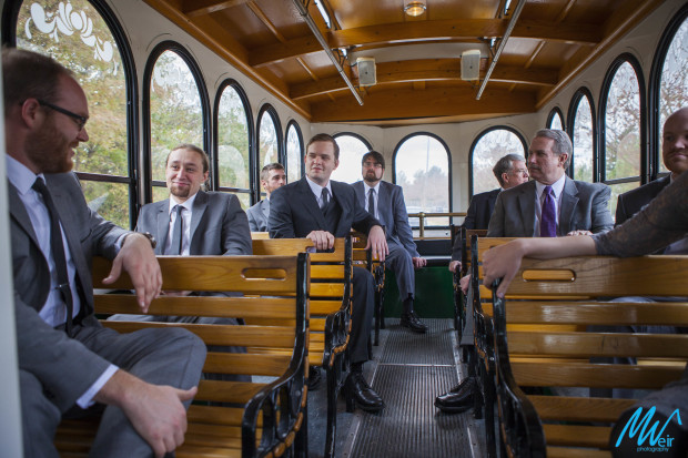 groomsmen on trolley to wedding