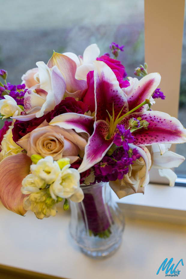 bridal bouquets with lilies, roses, and calla lilies