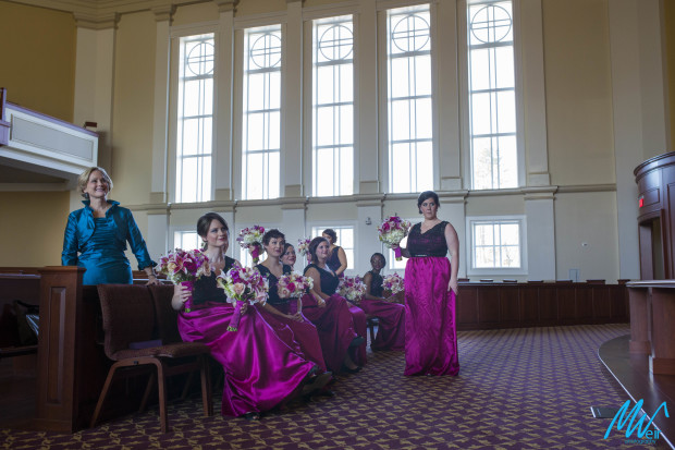 bridesmaid look on as photos are taken