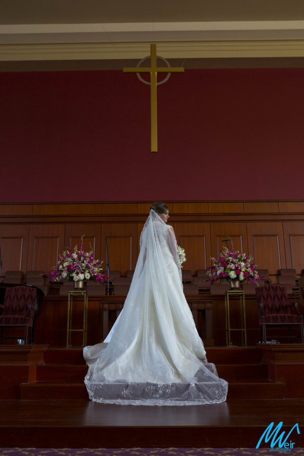 back of brides dress at the alter