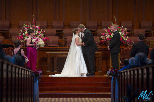 bride and groom share first kiss as husband and wife