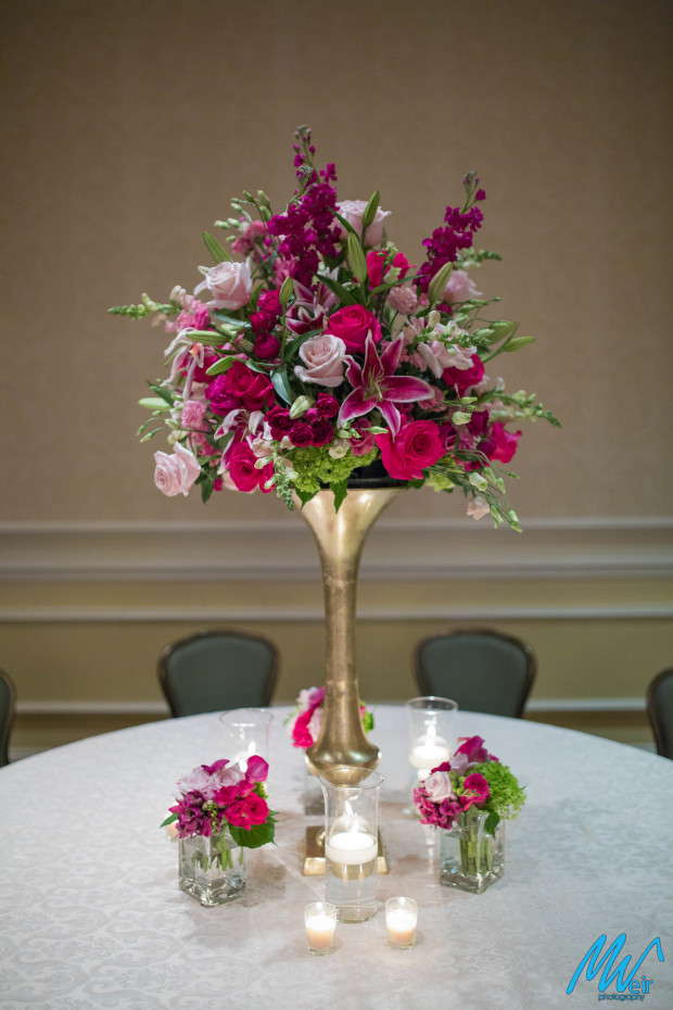 tall table centerpiece with lilies and roses