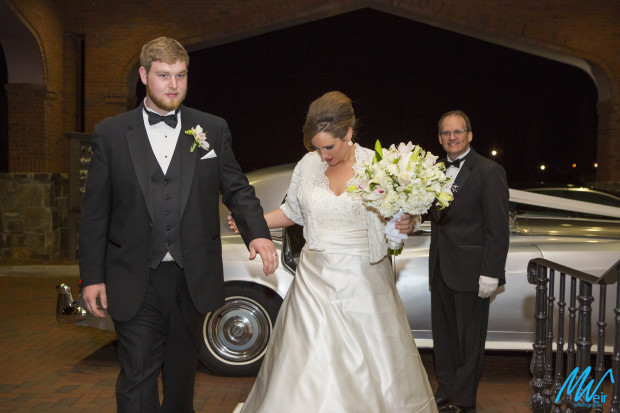 bride and groom arrive in old car to wedding reception