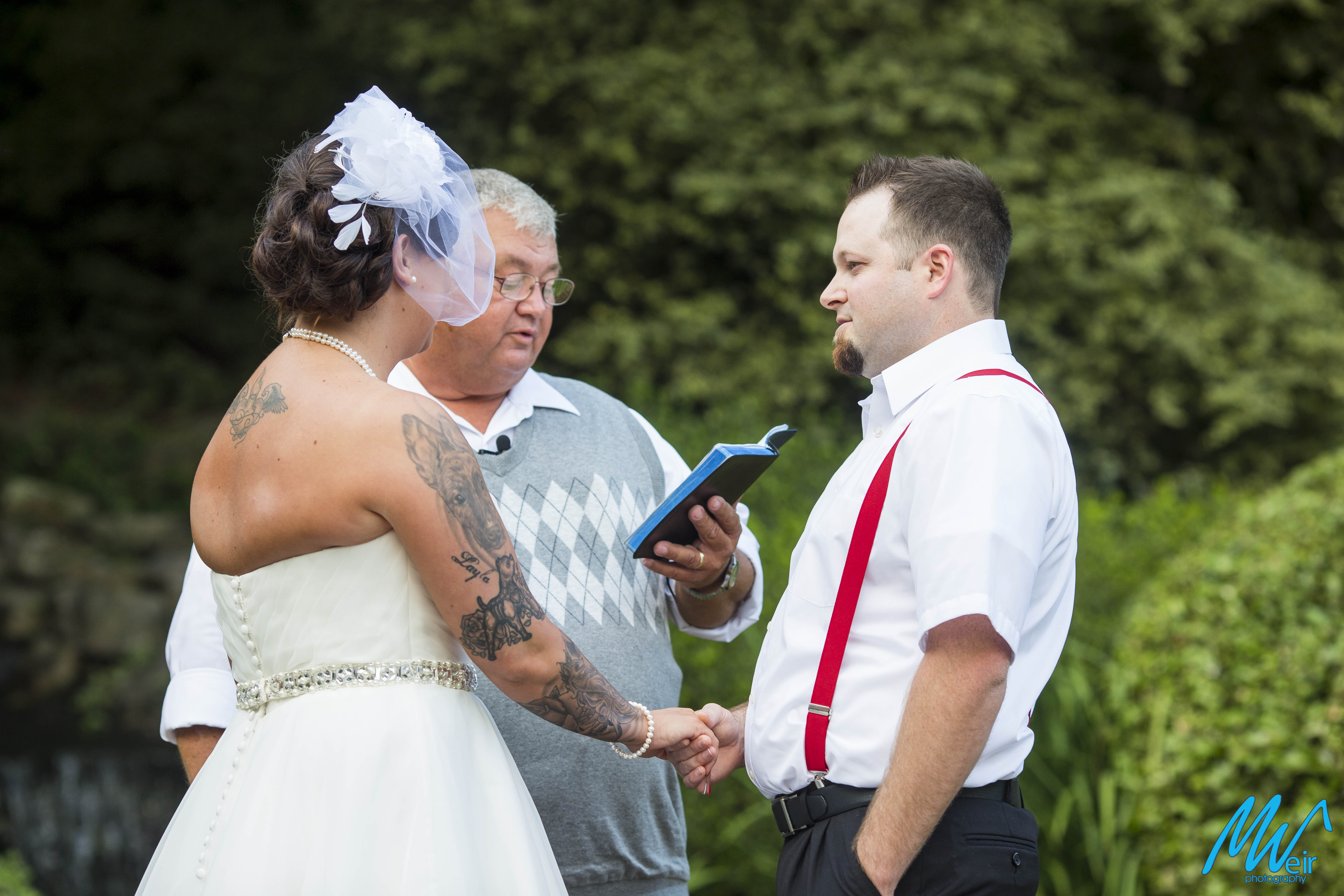 groom reciting vows during wedding ceremony