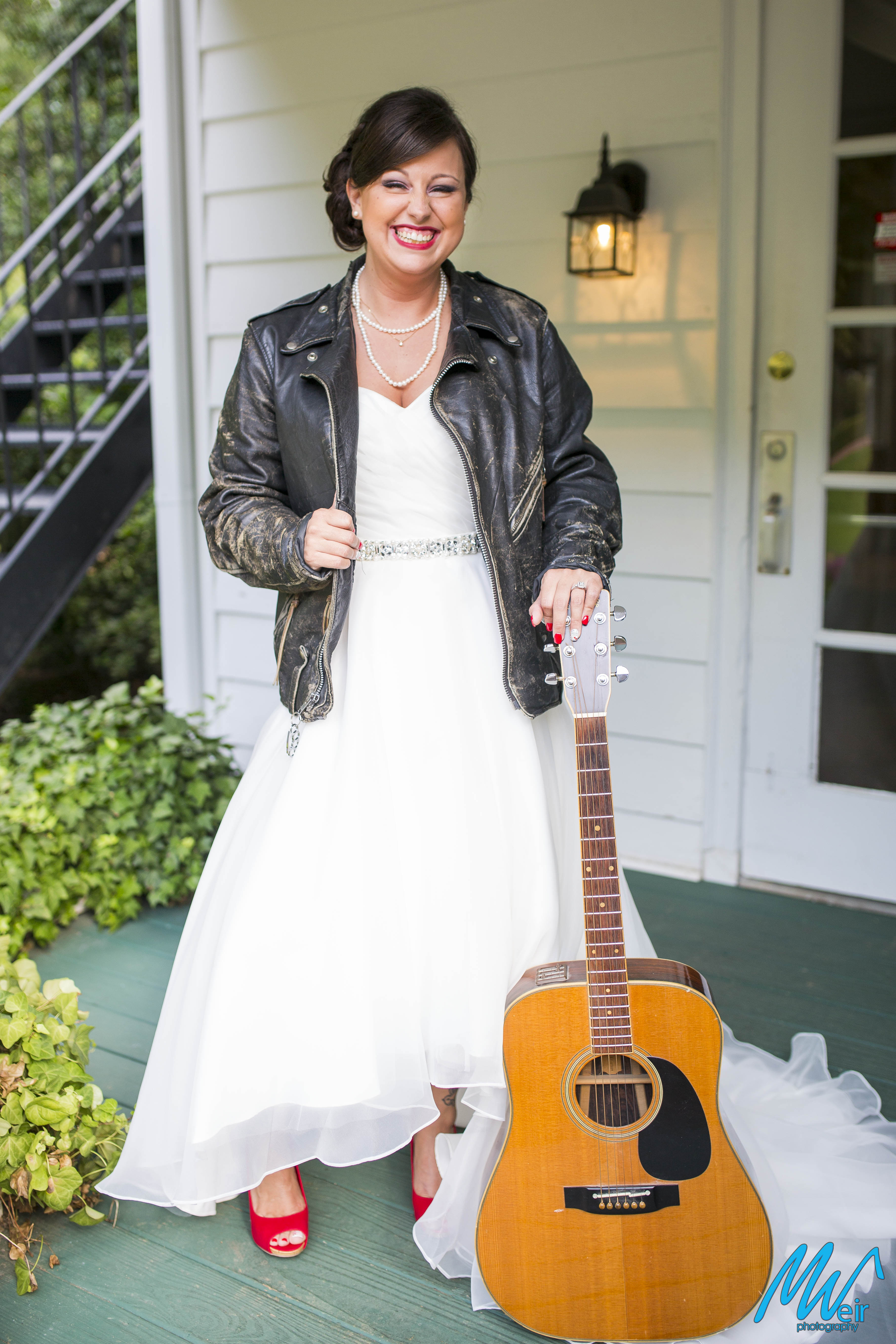 rock n roll bride in leather jacket and guitar