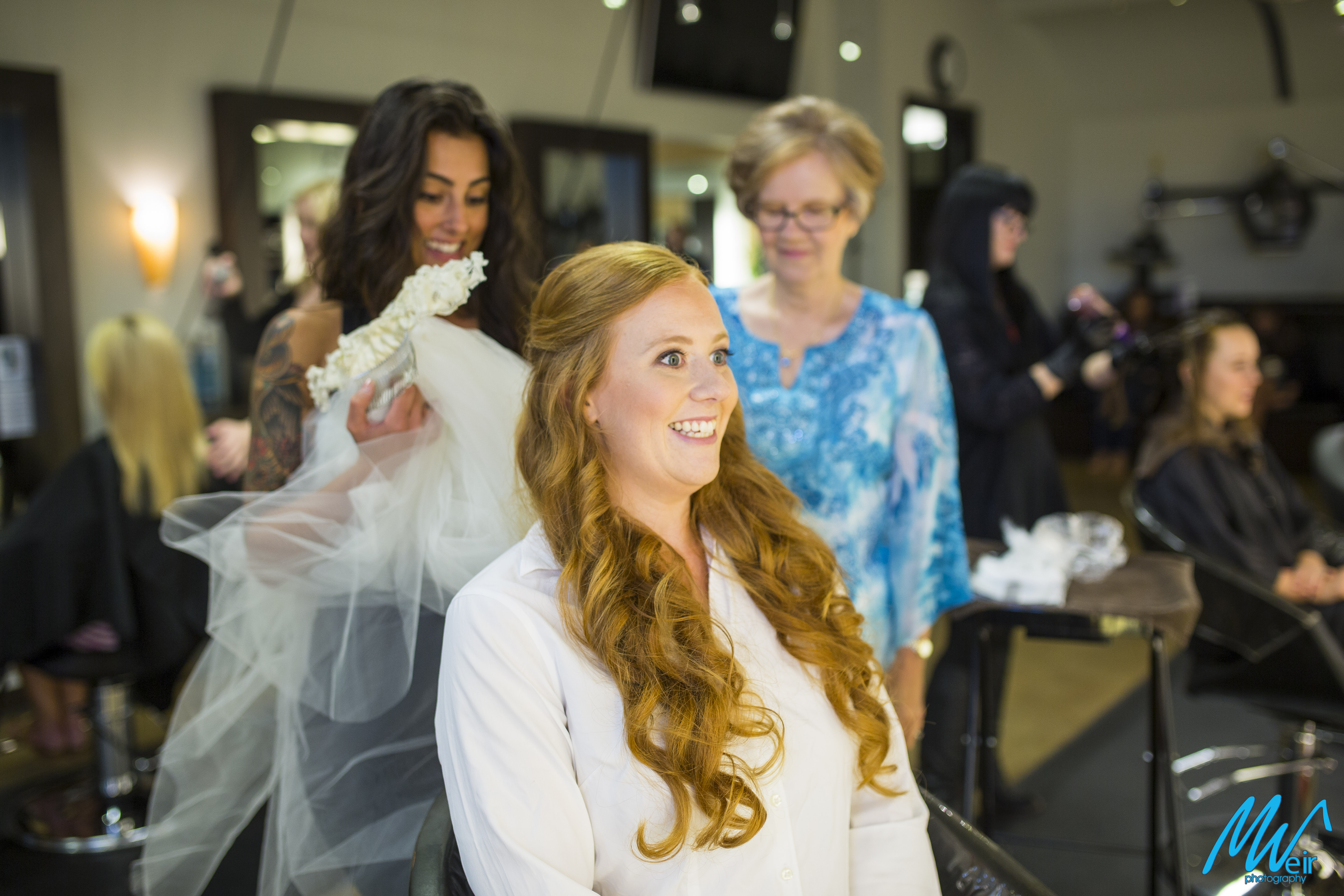 bride excited about getting veil put on