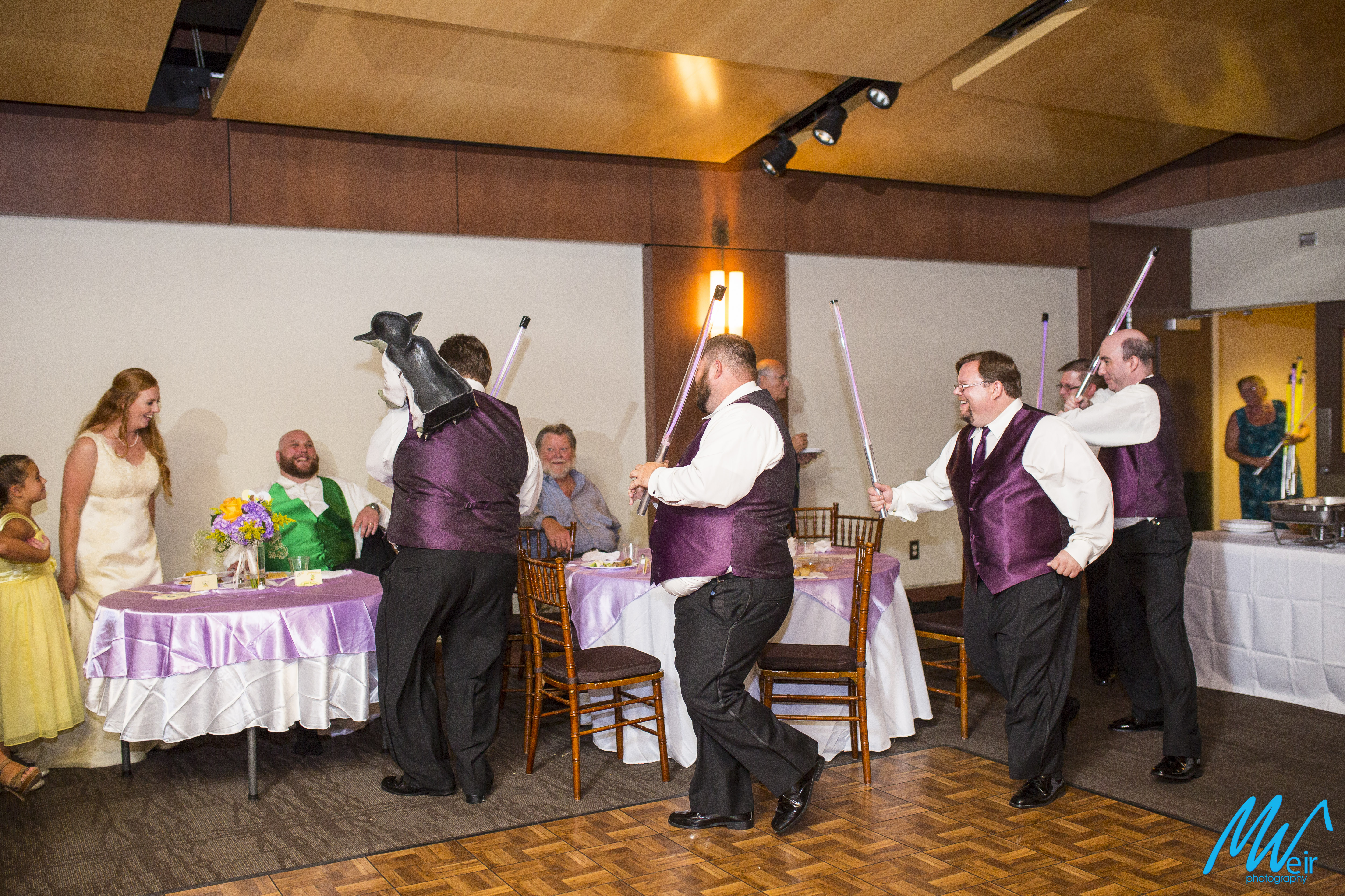 groomsmen surprise groom with star wars light sabers and yoda