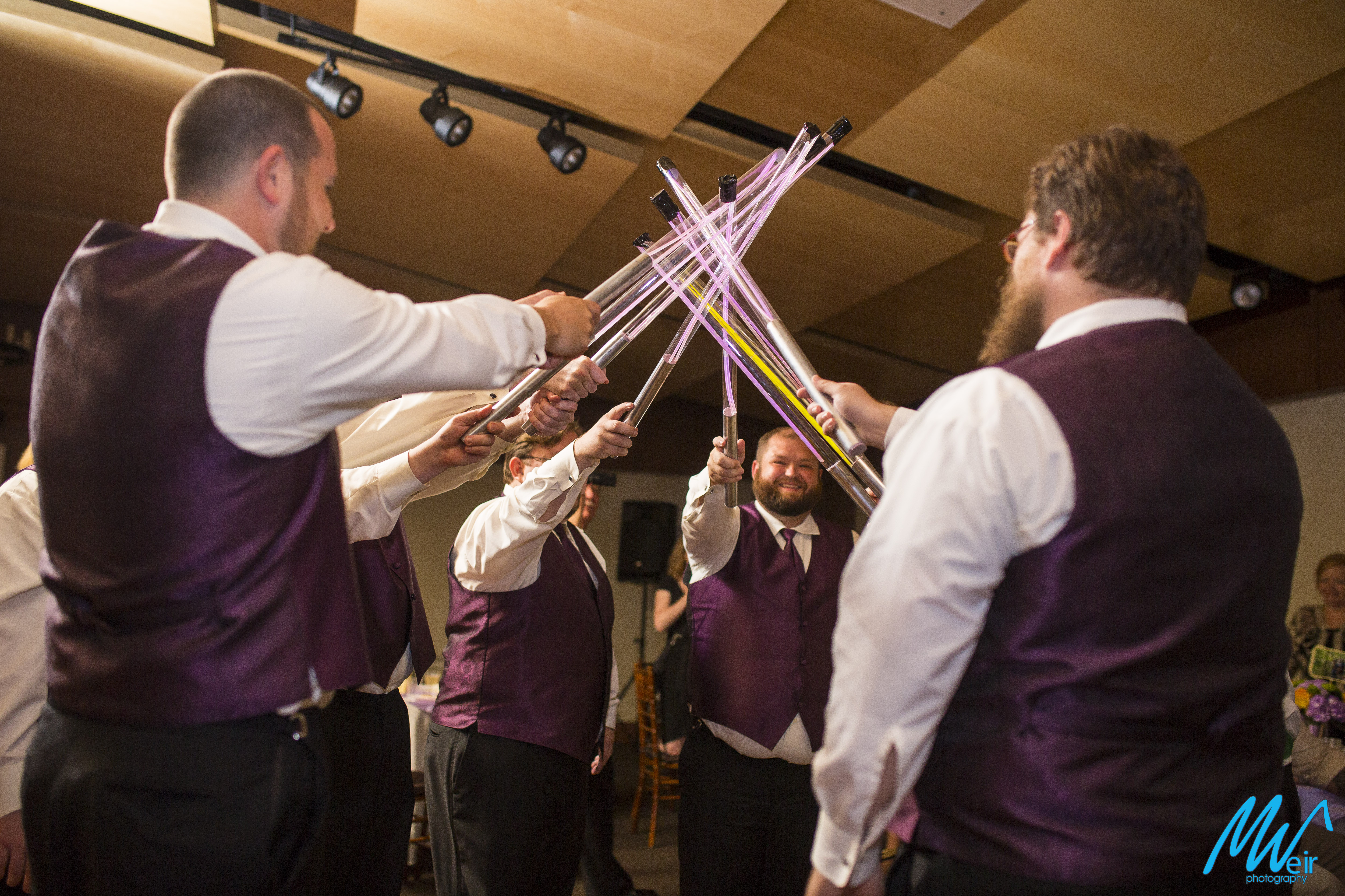 groomsmen toast with light sabers