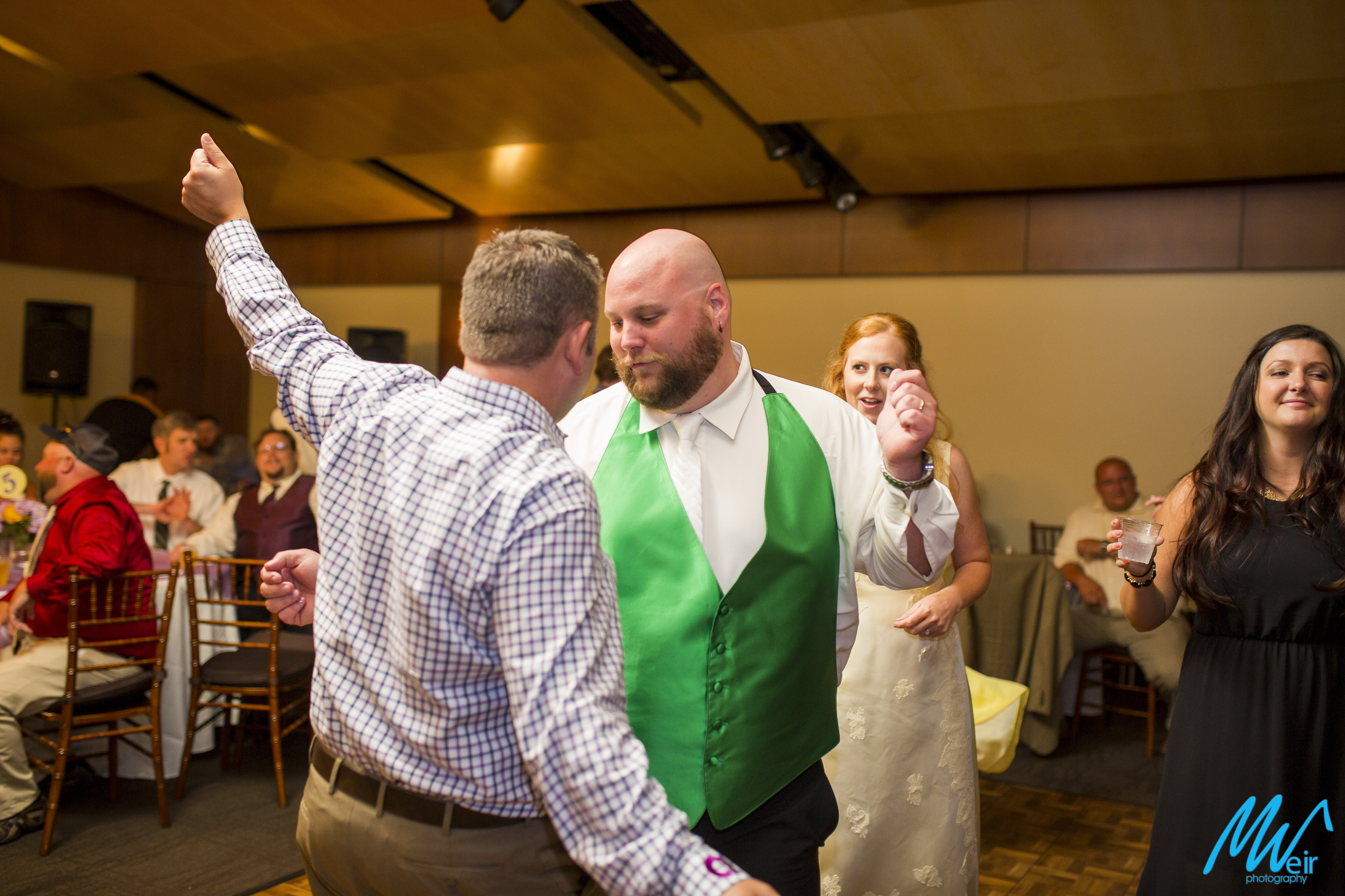 wedding guest and groom dances crazy at heritage hall