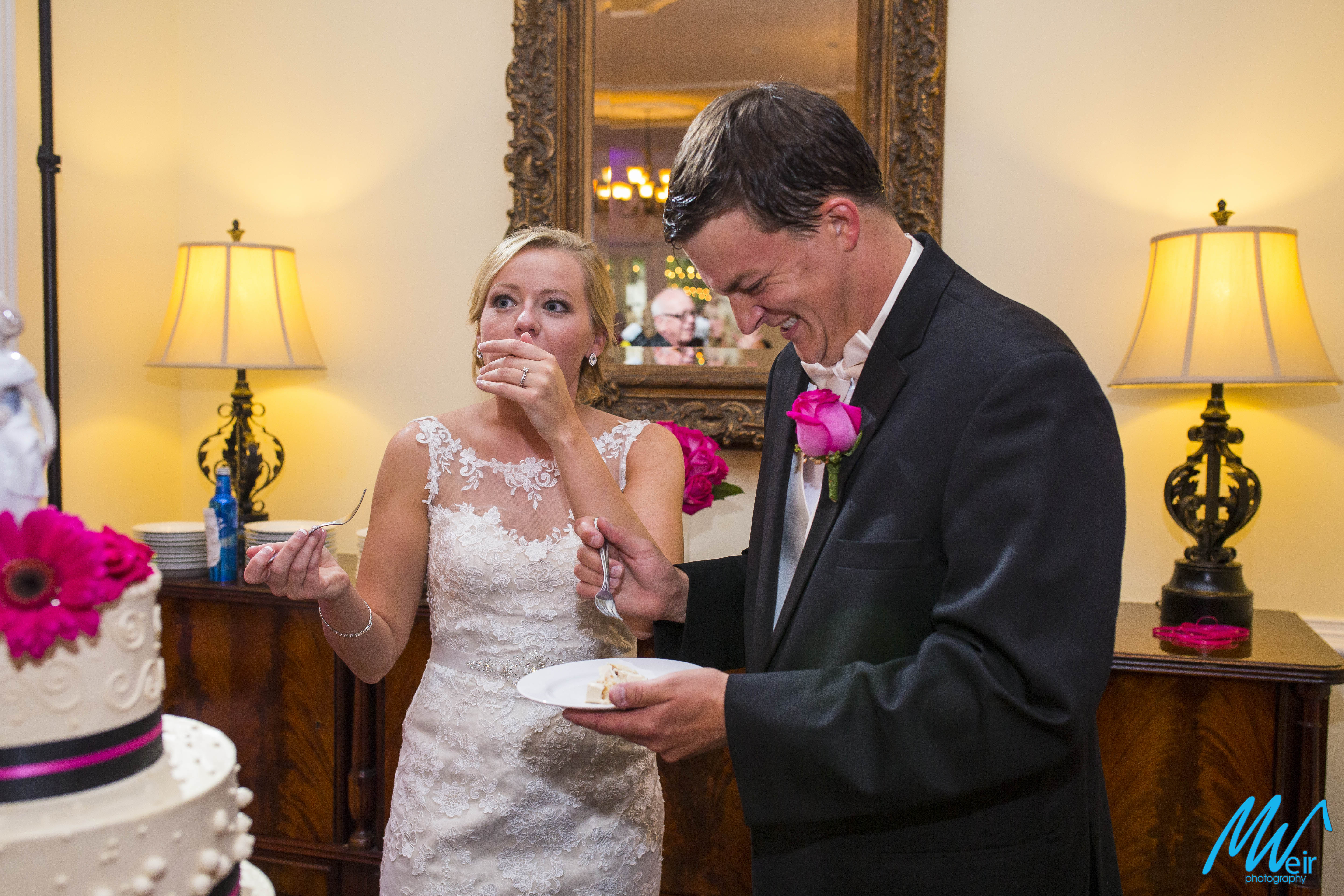 bride and groom enjoy wedding cake