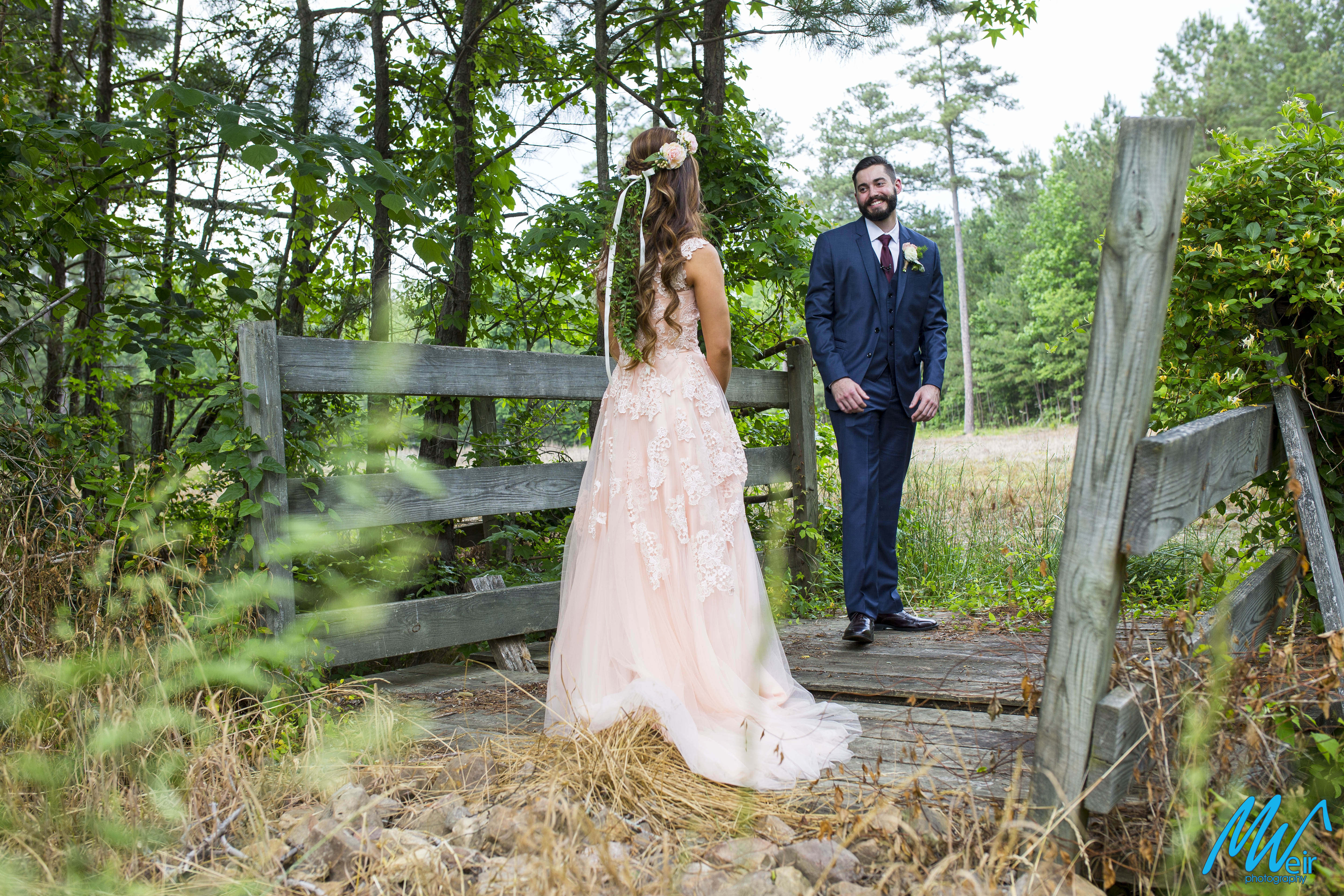 grooms turns around to see his bride during the first look