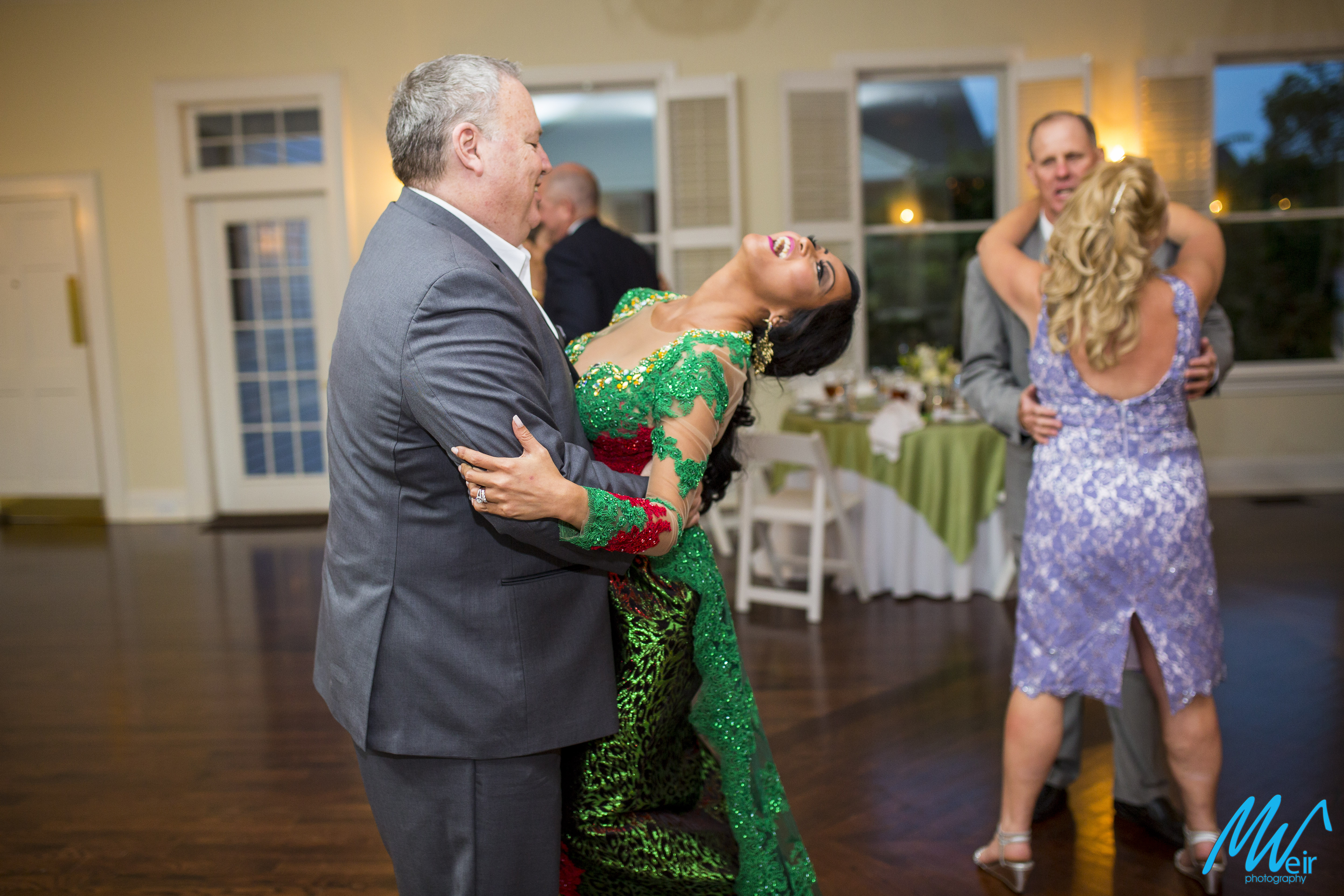 bride and groom share a dance after dress change