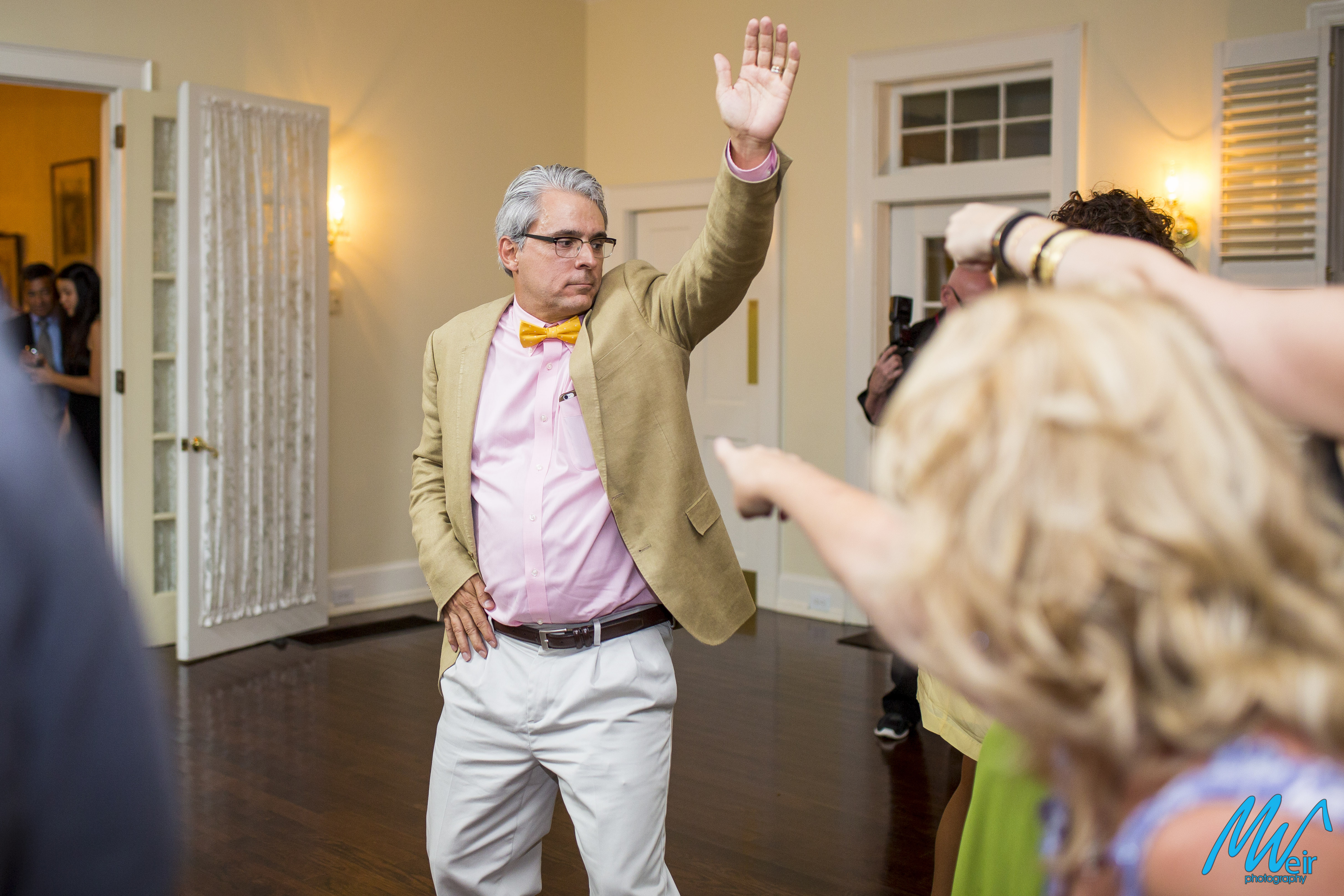 wedding guests dance during reception