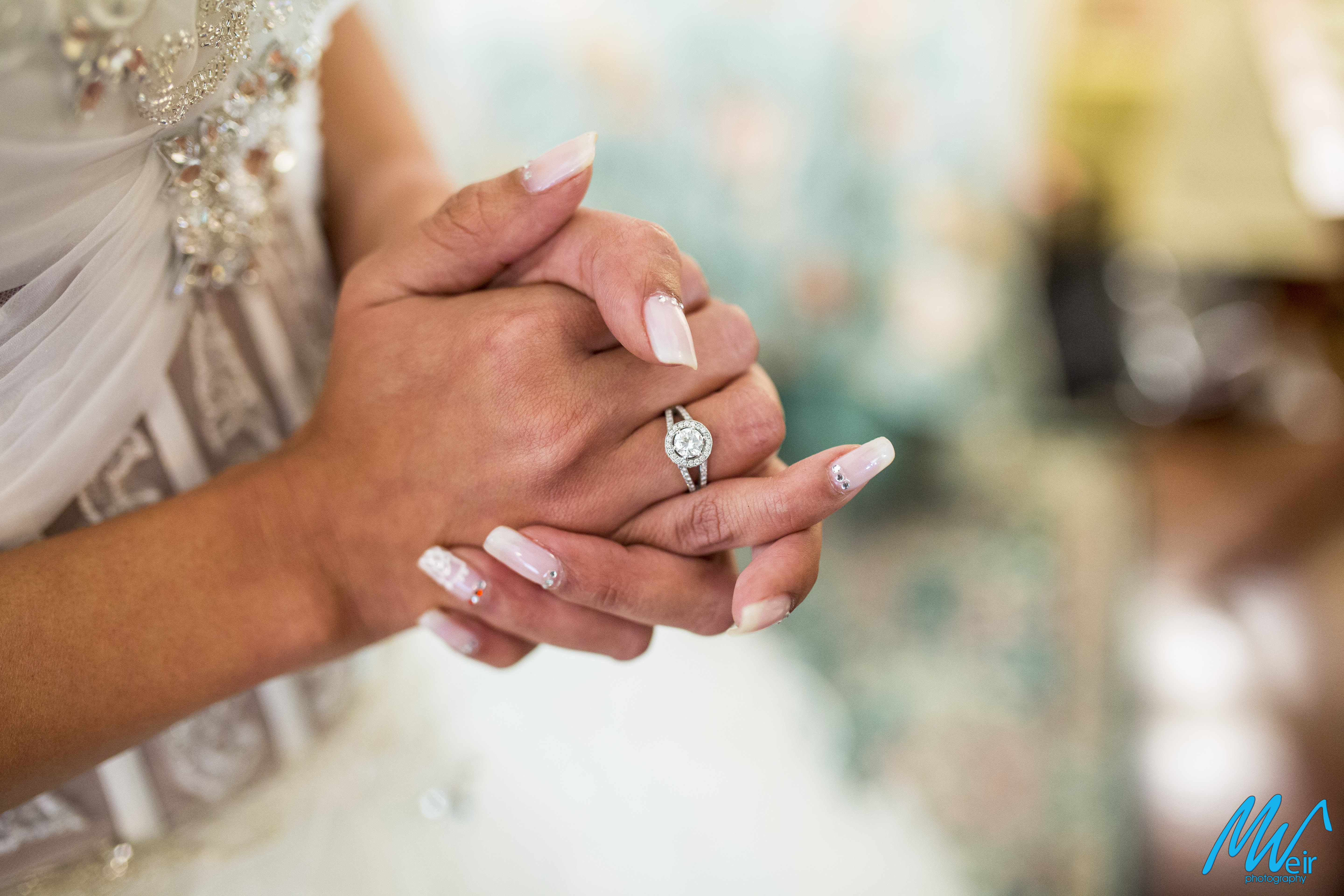closeup of brides engagement ring on her hand