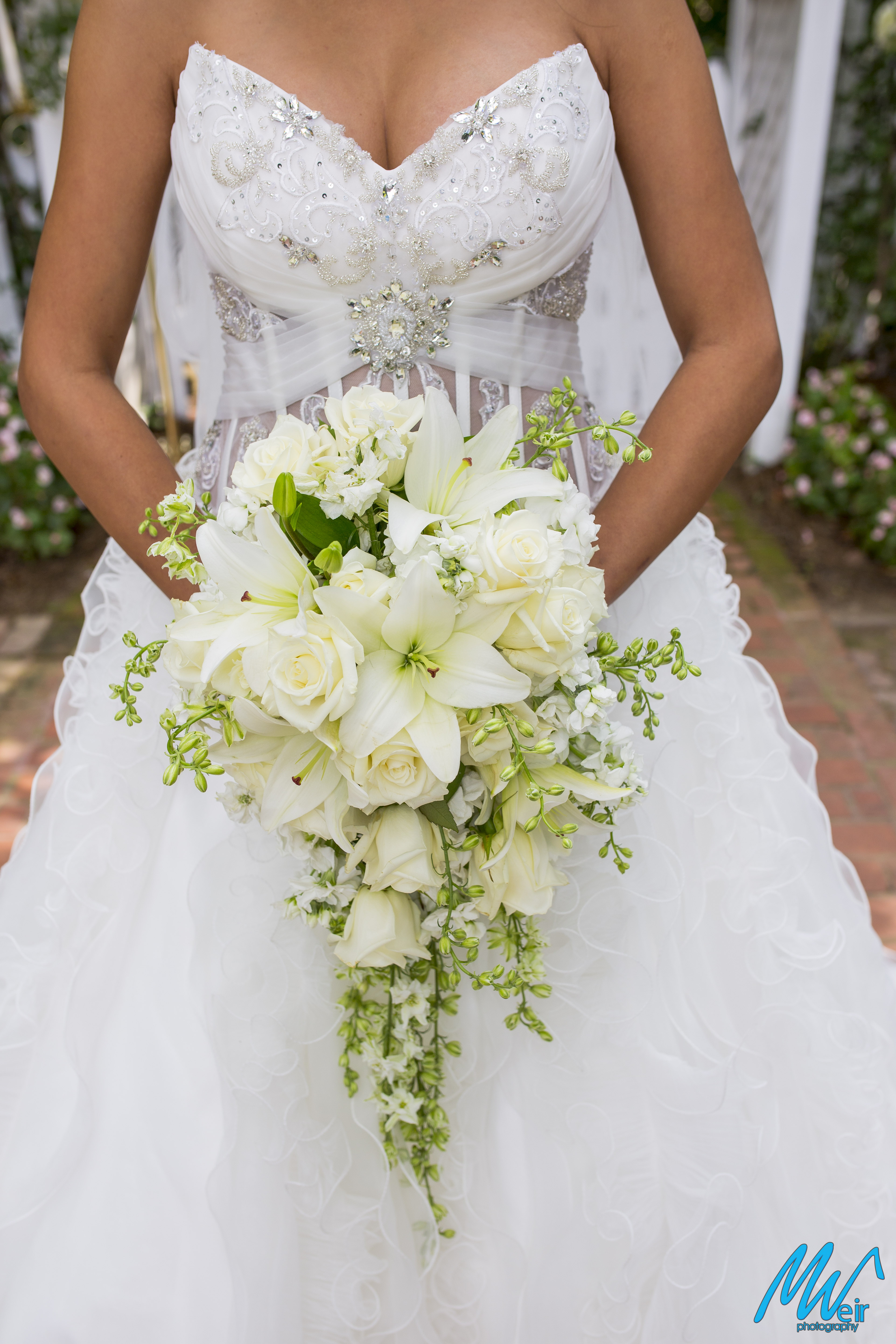 detail of brides white rose cascading bouquet
