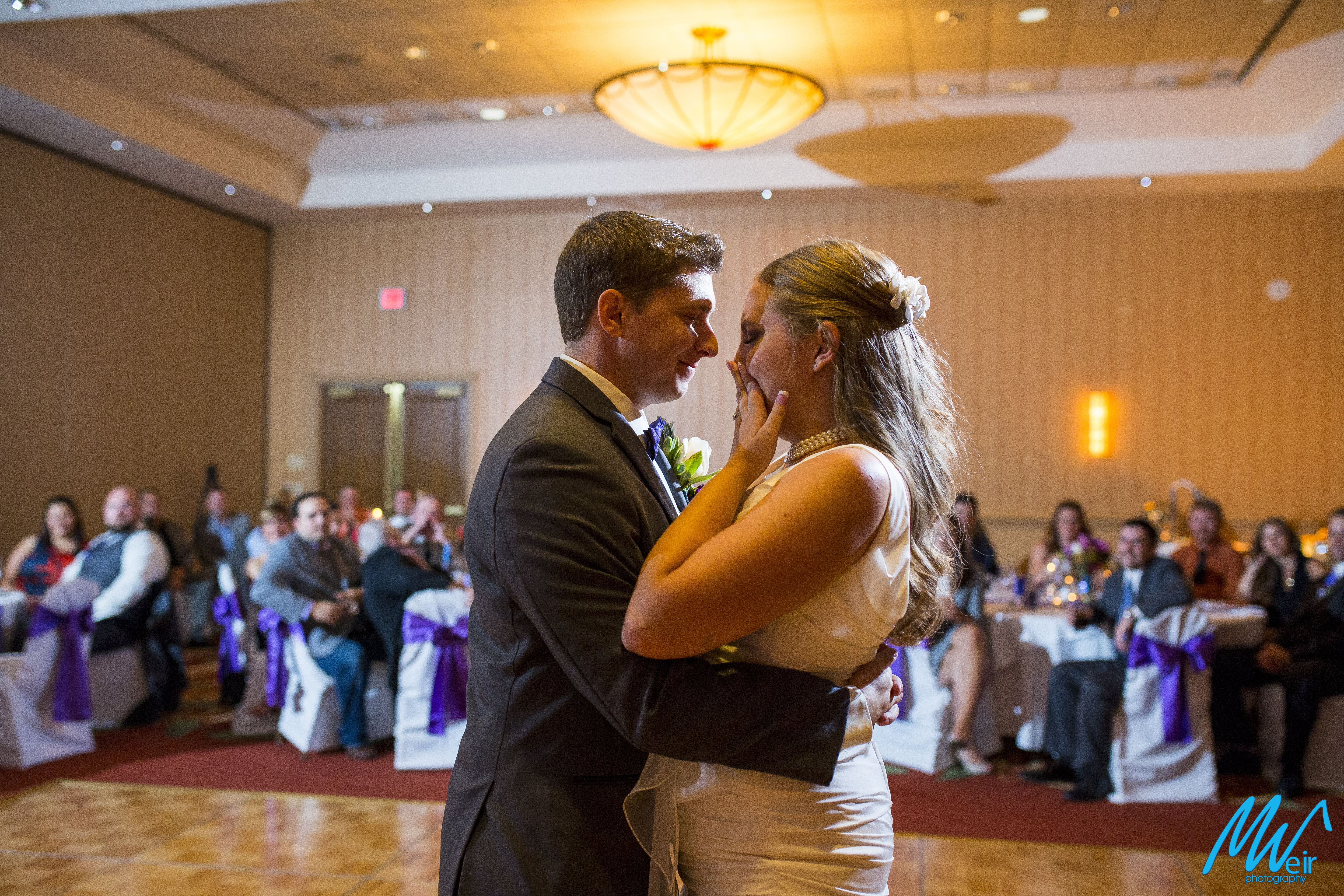 bride gets emotional during first dance as husband and wife