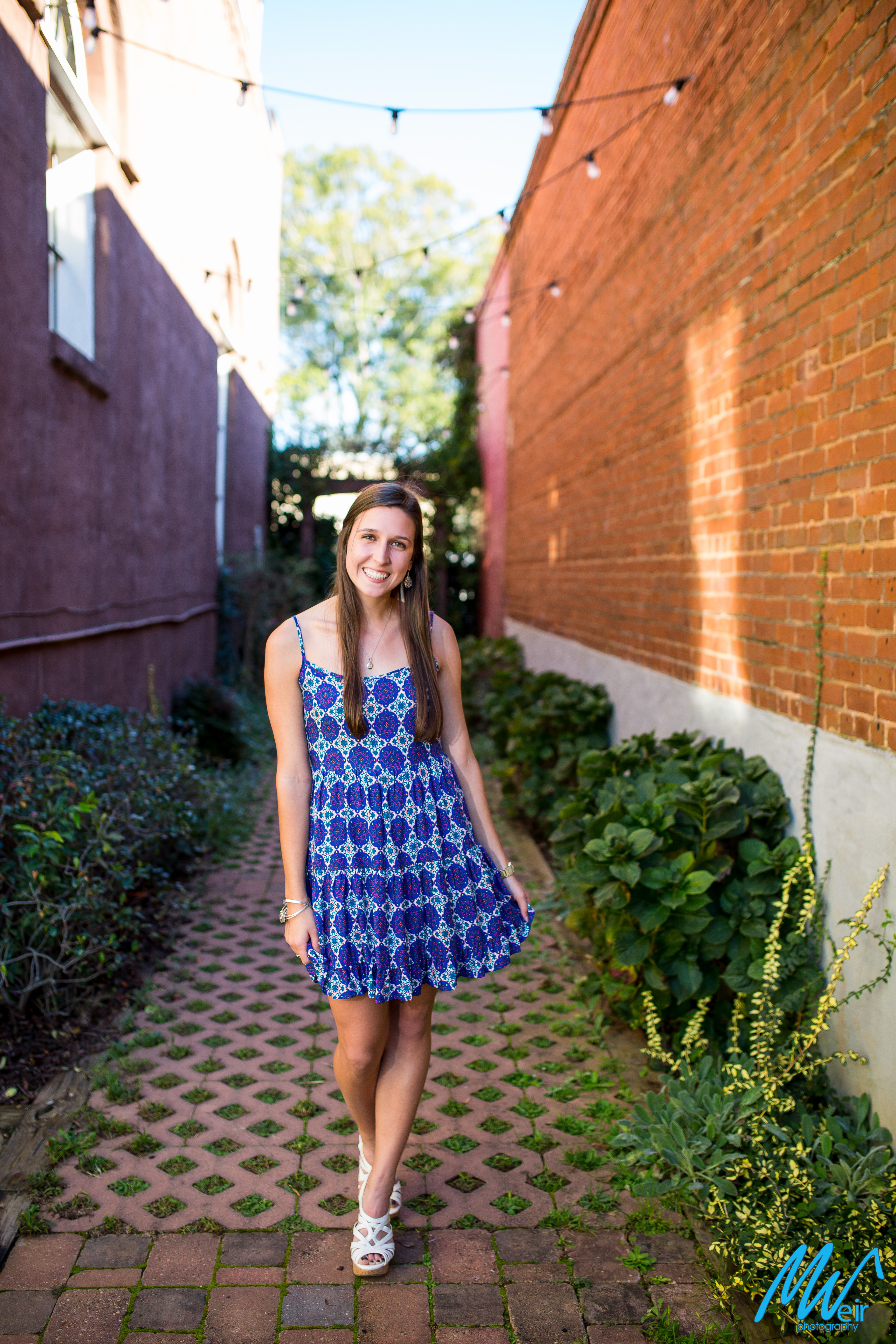 high school senior in an brick paver alley