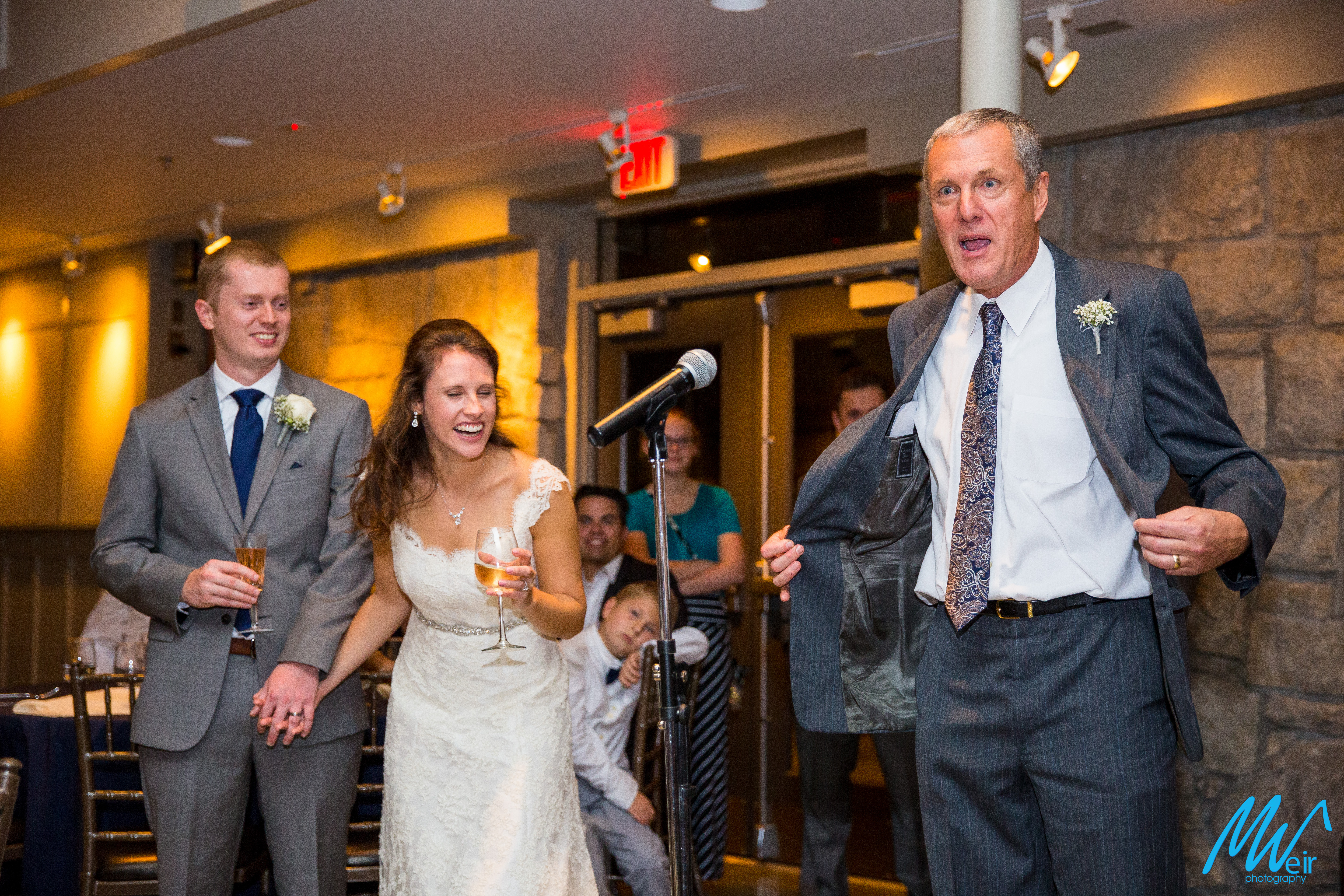father of the bride shares a joke during toast