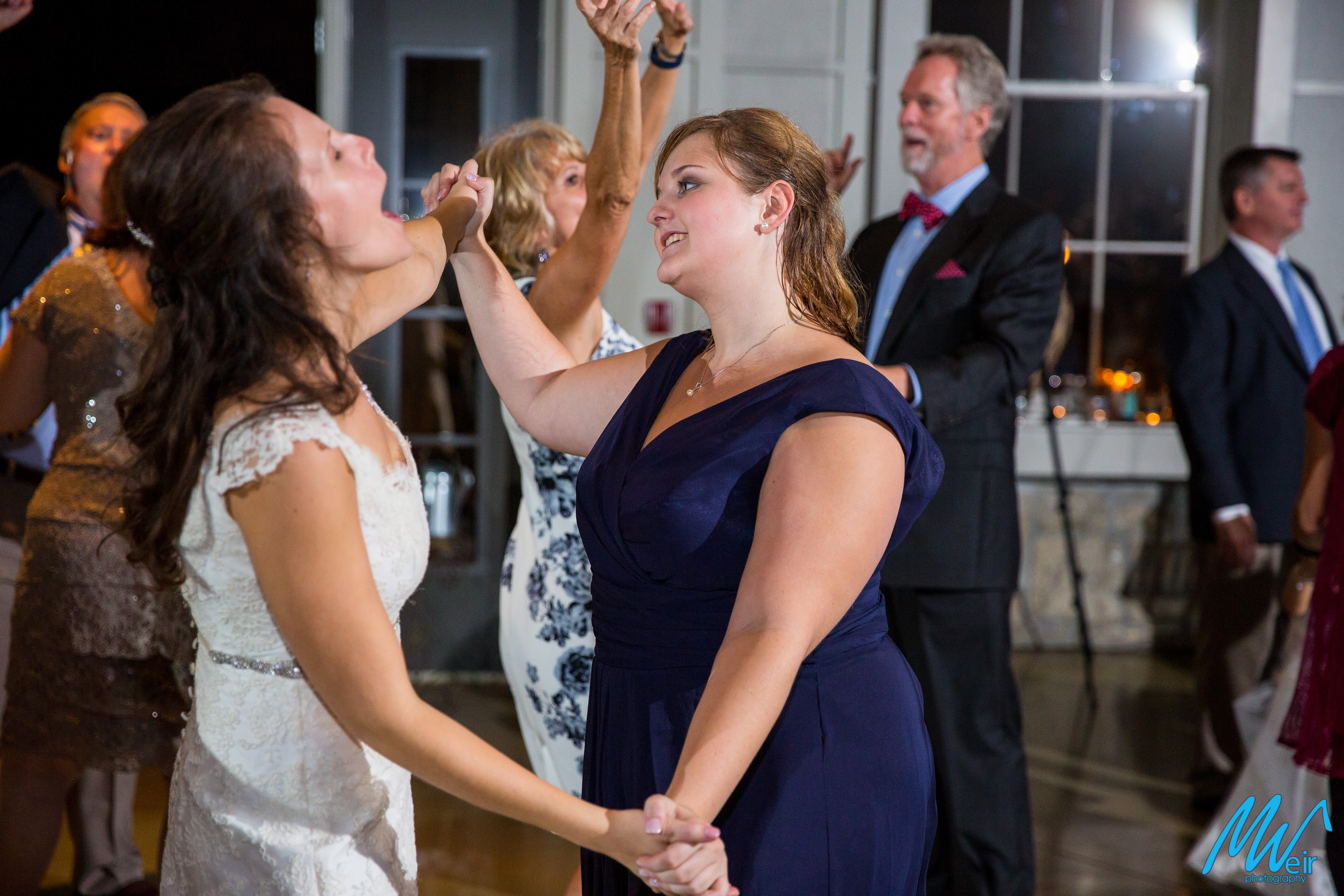 bride dances with sister at reception