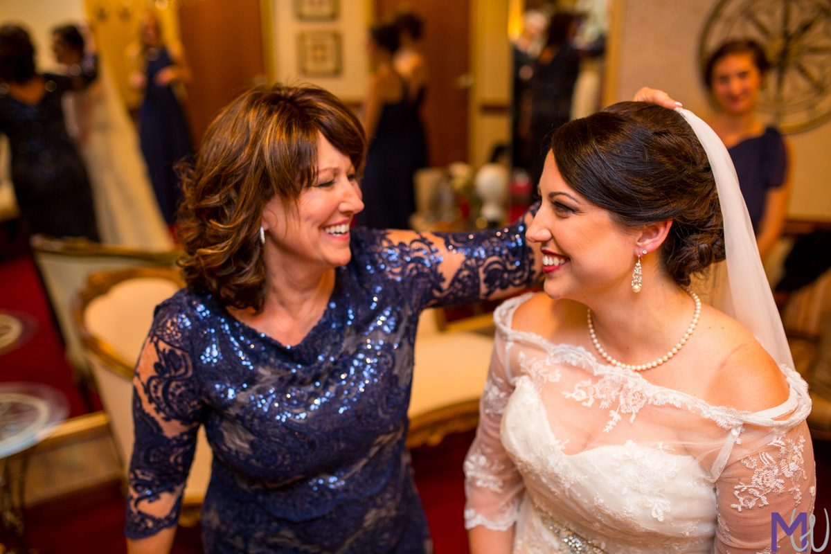 mom and bride share a moment