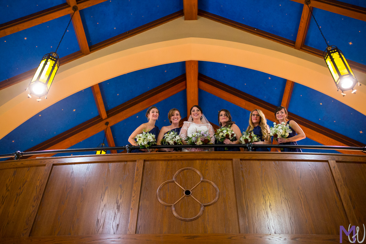 bridesmaids in church balcony