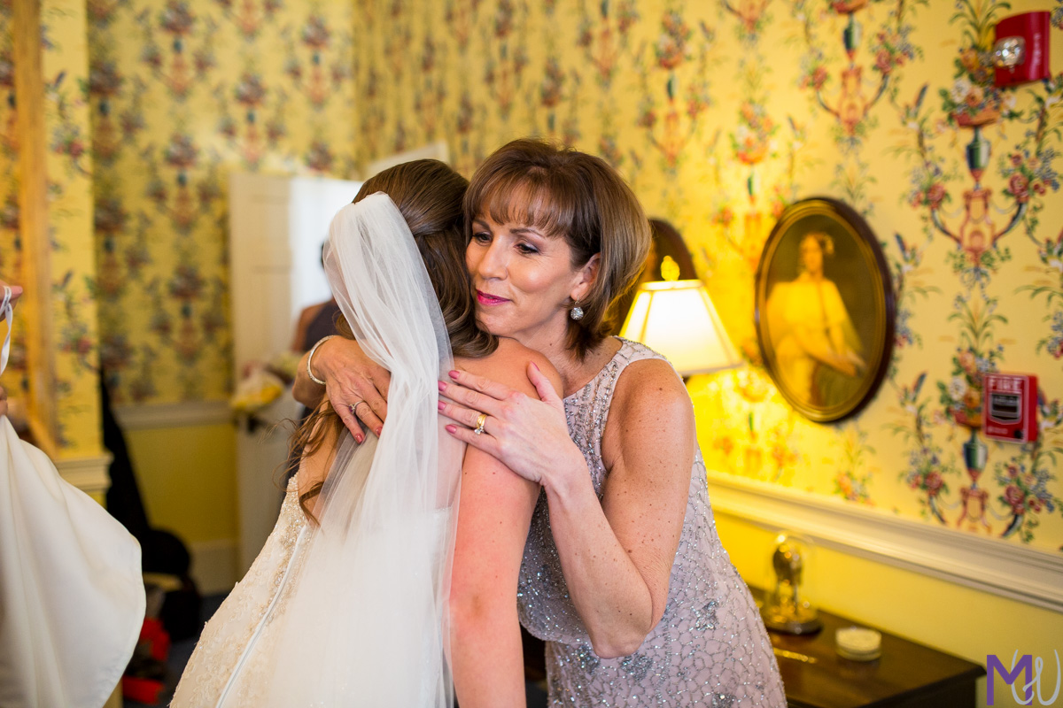 bride and mother of groom hug