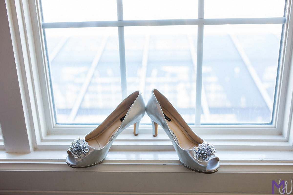 wedding shoes on a window