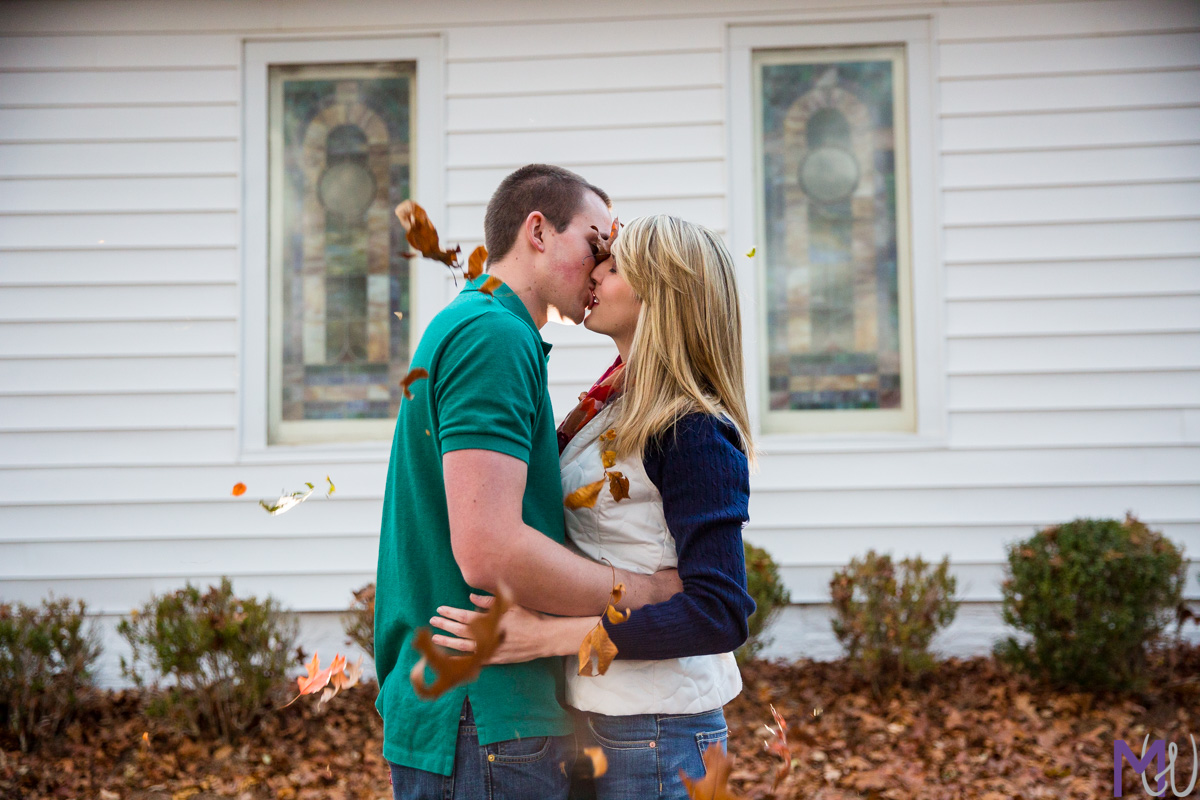 engagement photos at small local church with fall leaves
