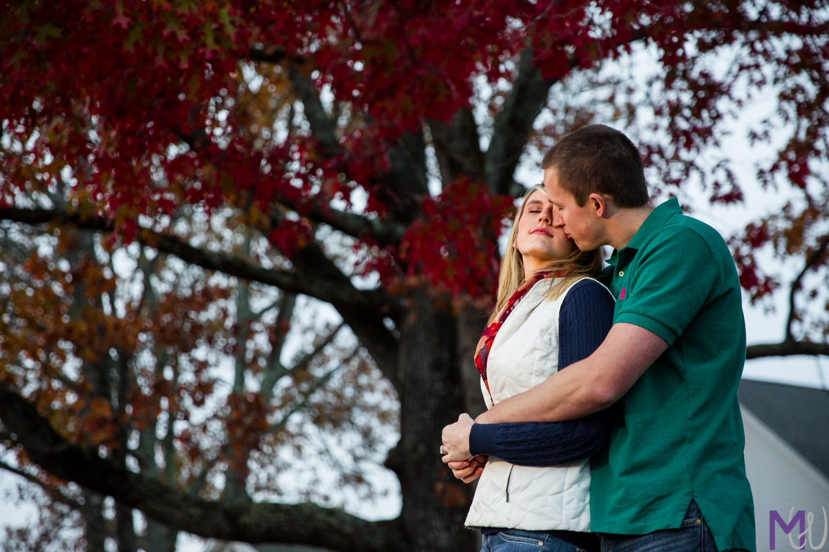 engagement photos at small local church with red fall leaves