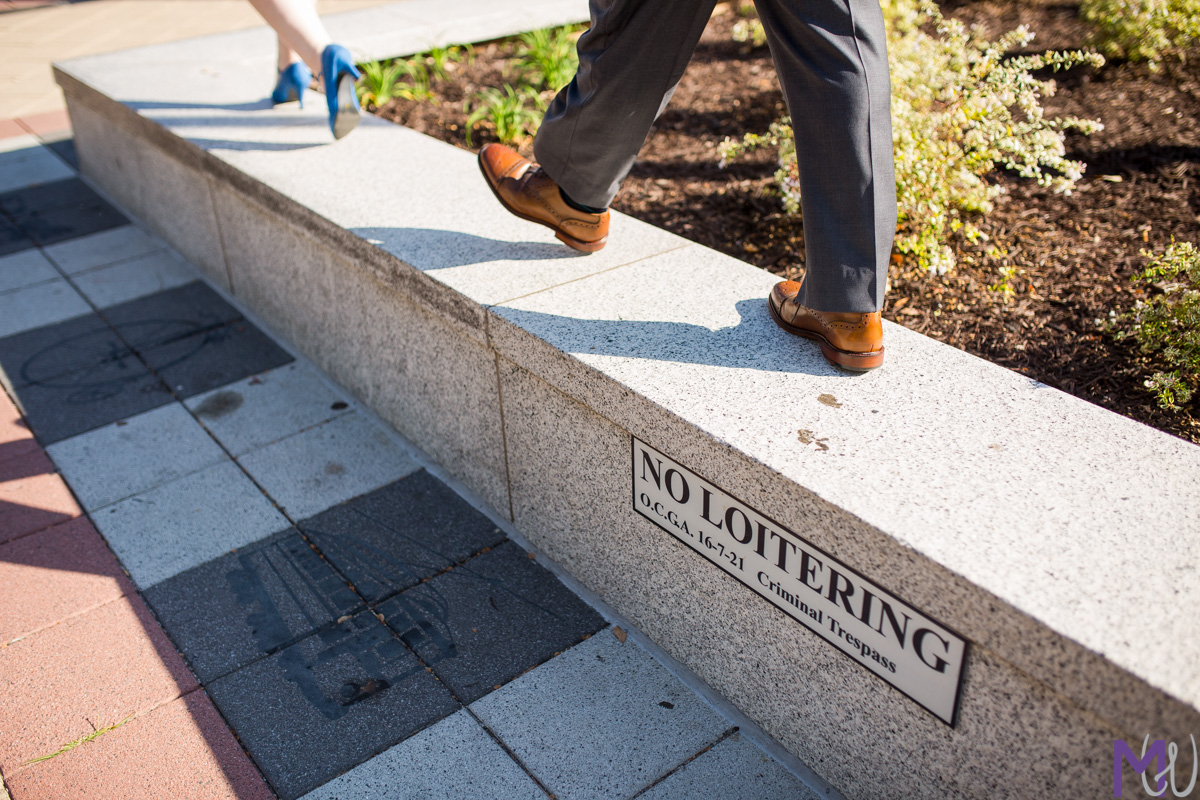 walking on a no loitering sign