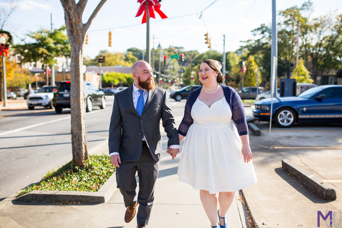 bride and groom walking down the street