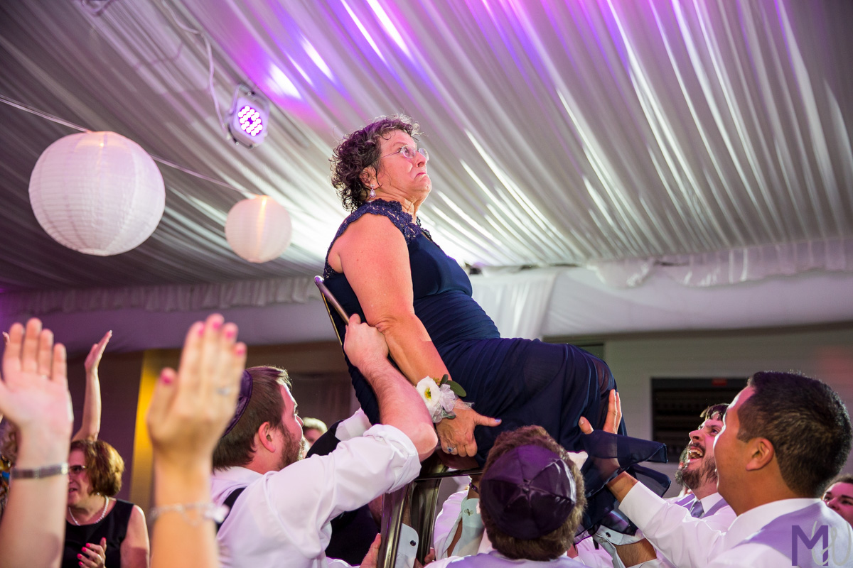 mother lifted on chair during hora