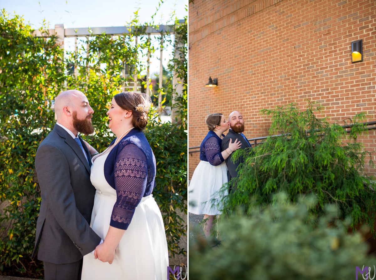 bride and groom in front of brick building