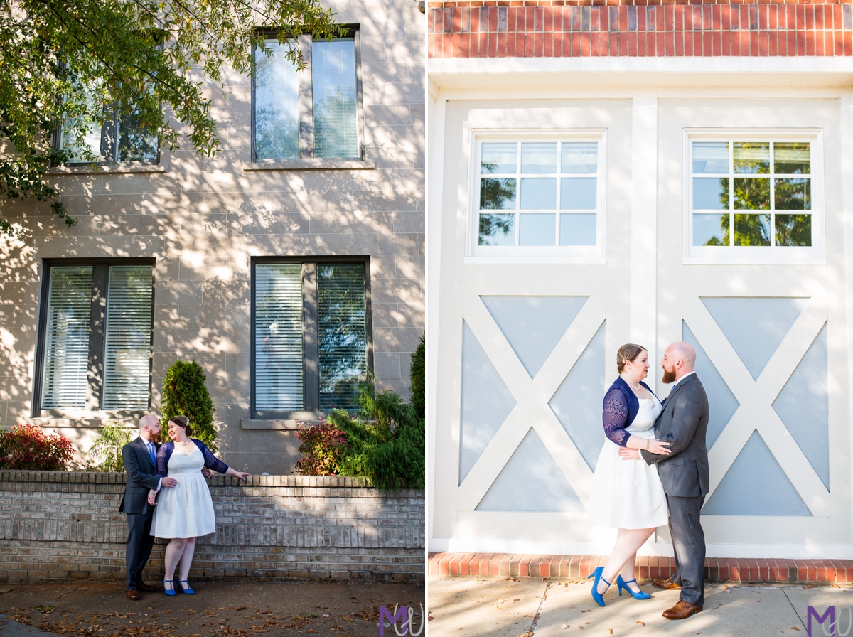bride and groom in front of brick building