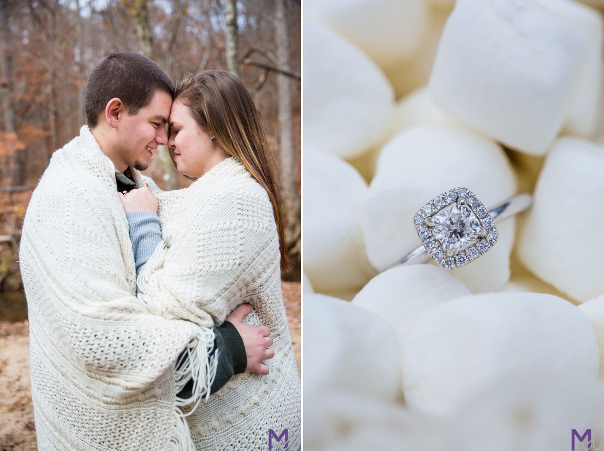 couple wrapped in a blanket engagement ring in marshmallows