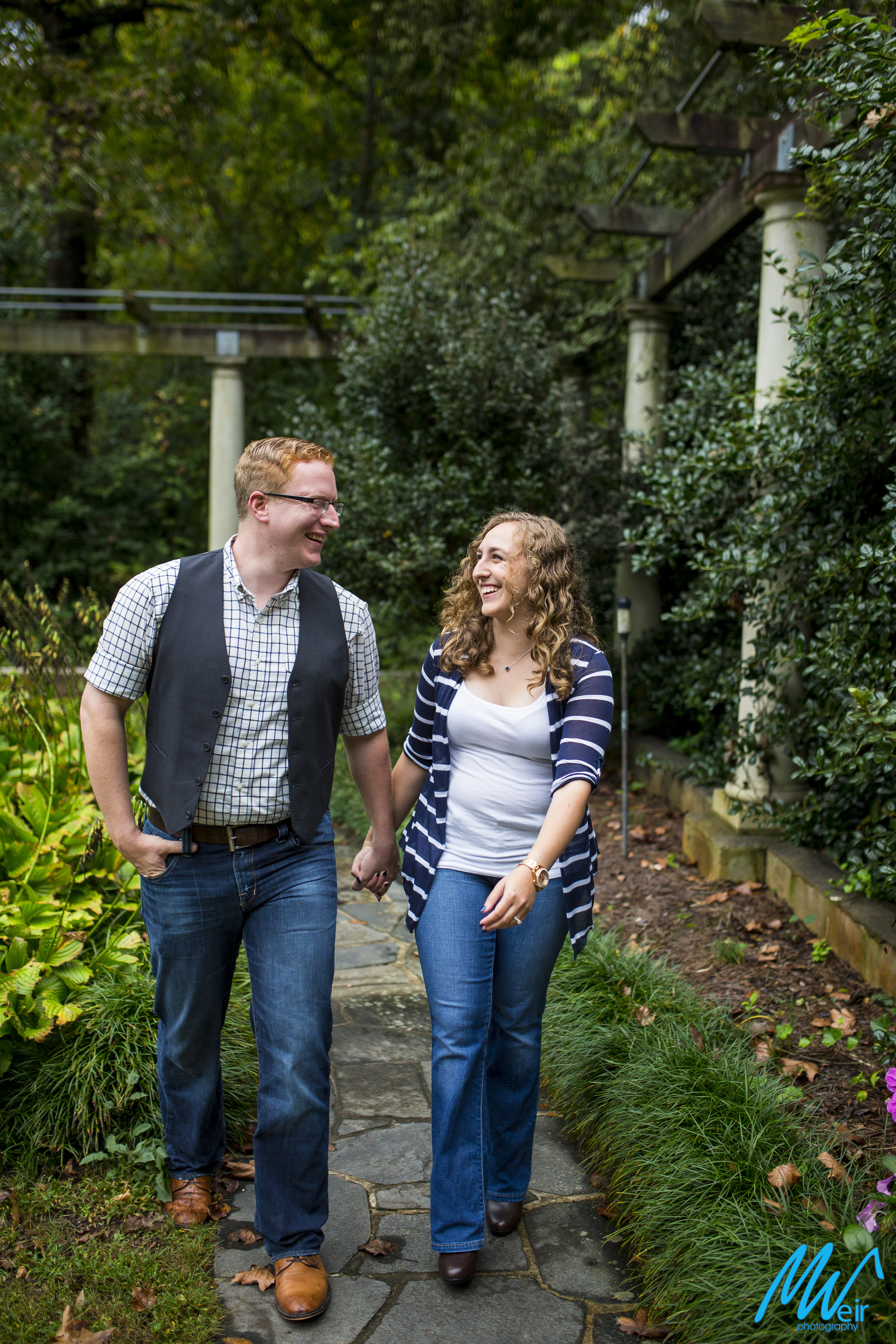 couple walk through the gardens together